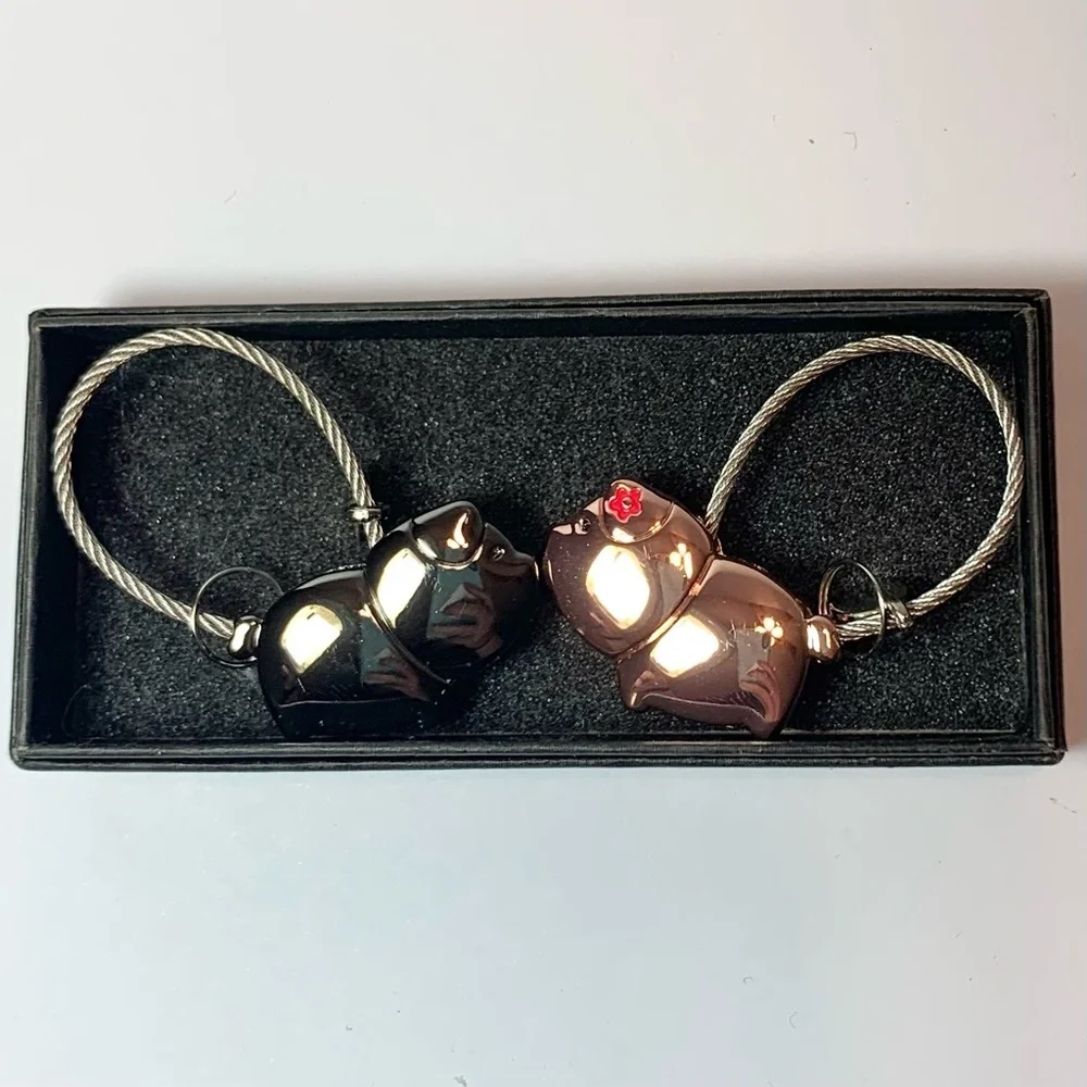 2 Charming Metal Piggies Cord Keychains